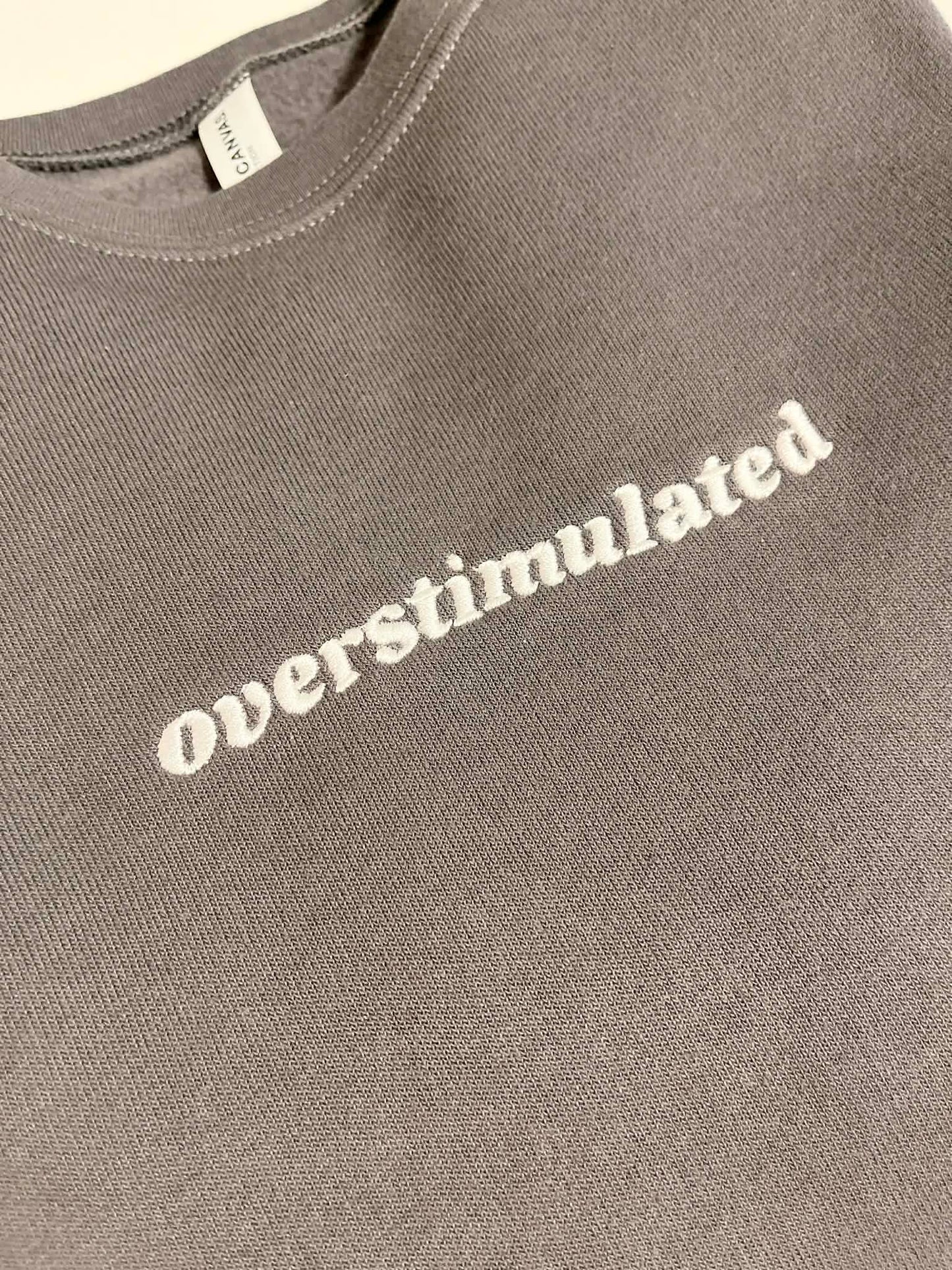 Overstimulated Embroidered Sweatshirt  - Dark Grey with White Text